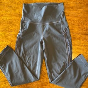 Lulu lemon grey yoga pants with angled cropped leg and side embellishment. XS